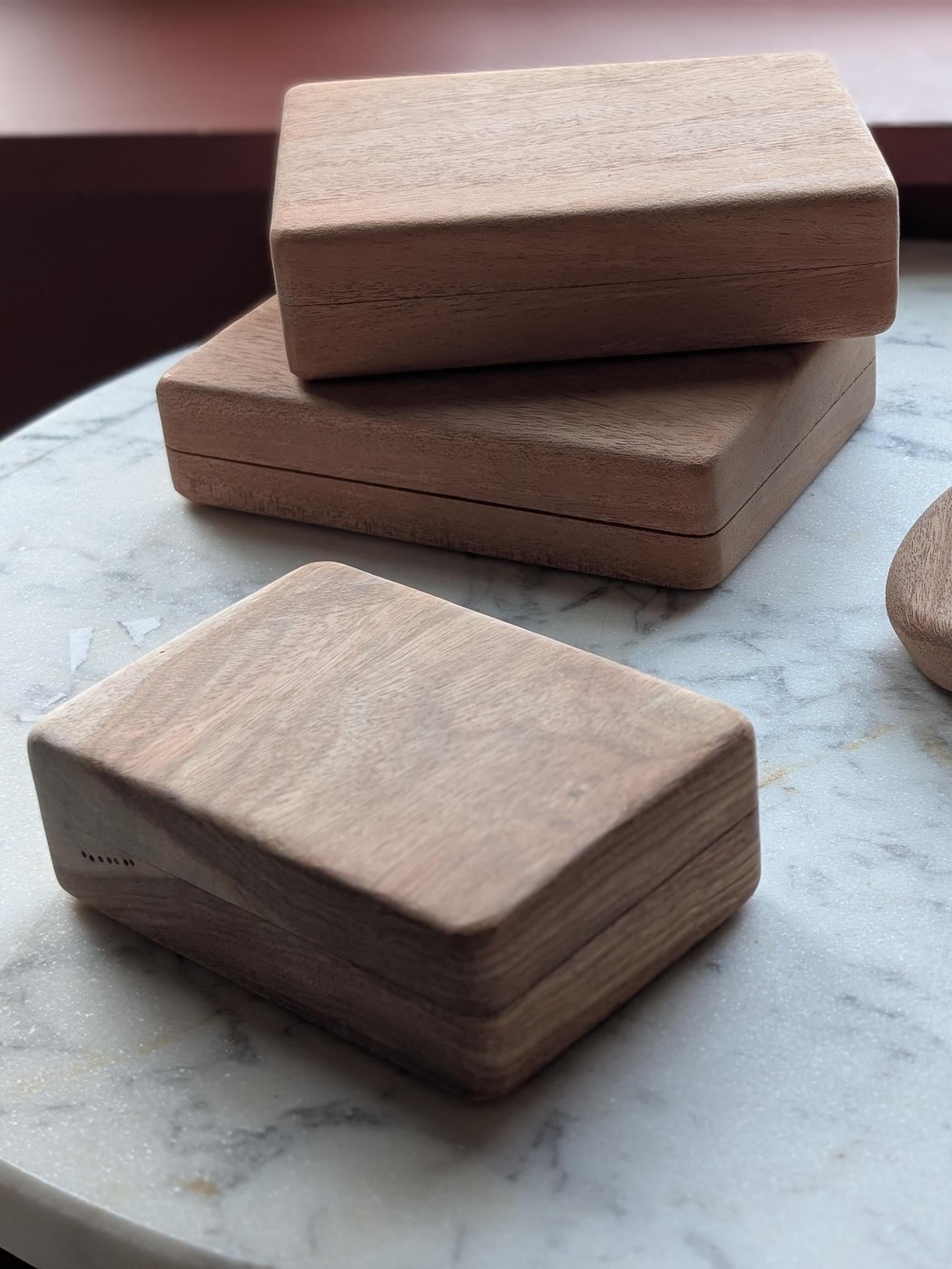 Bolivian rosewood card boxes — single deck in front, two double deck behind