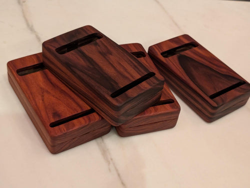 Four bidding boxes stacked, card slots visible